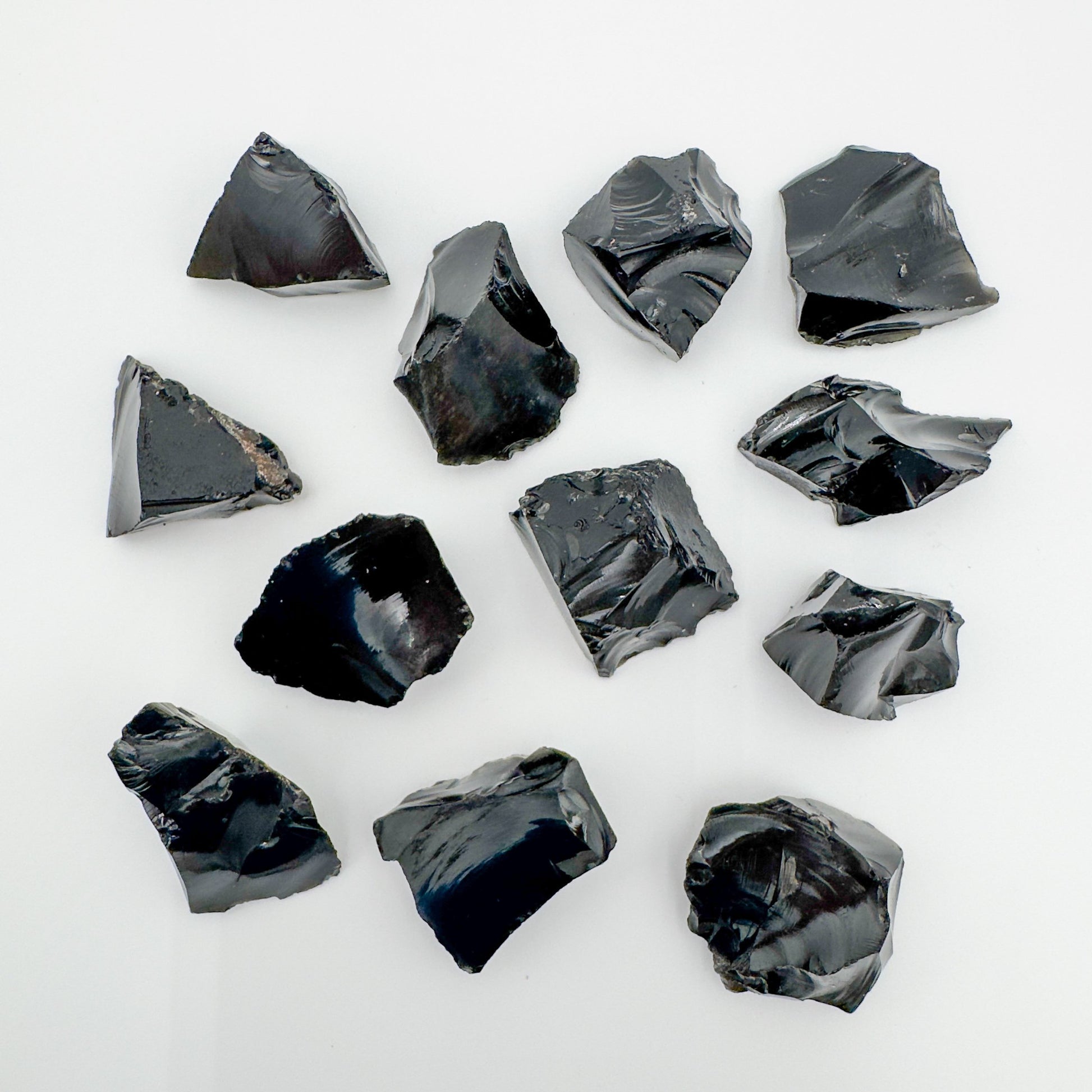 Close detail of Black Obsidian raw stone, showing natural texture.