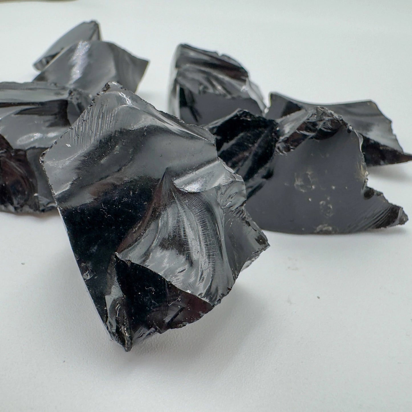 Profile view of Grade AA Black Obsidian raw stone, sourced from Argentina.