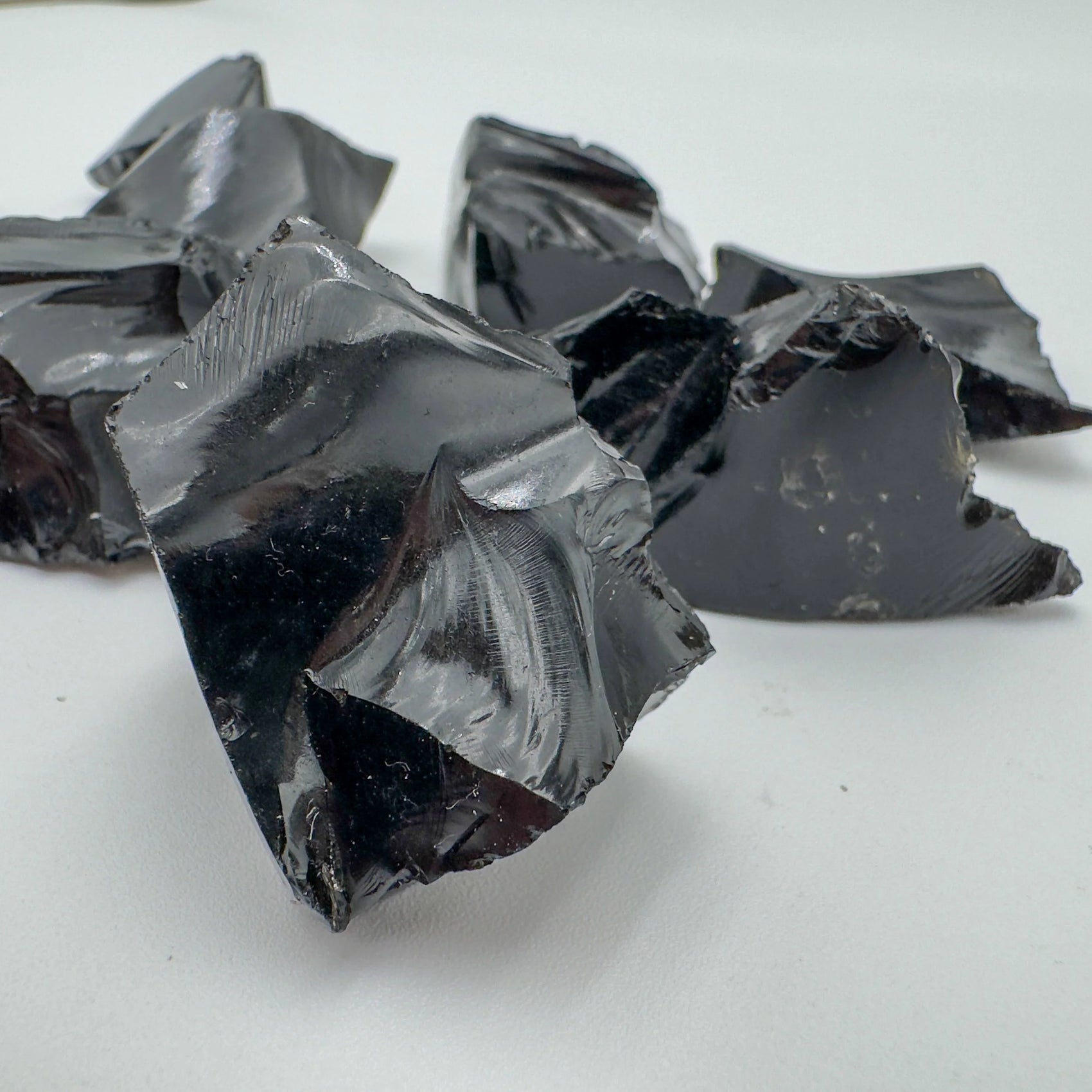 Close-up of Black Obsidian raw stone from Argentina, soothing wellness stone for Emotional Healing
