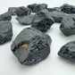 Top view of Black Tourmaline raw stone, carried for Protection and Grounding, showing natural color depth.