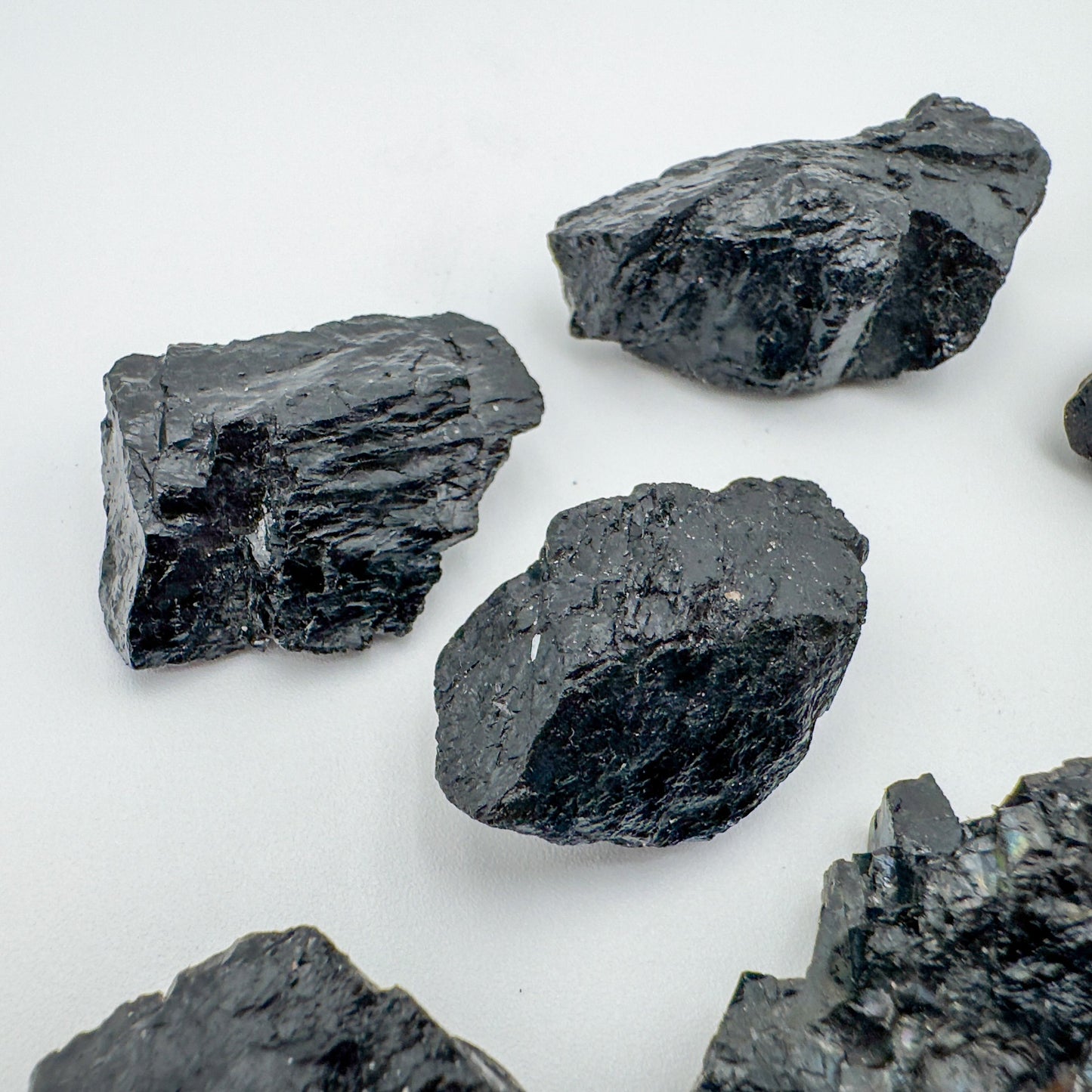 Alternate angle of Grade A Black Tourmaline raw showing overall shape