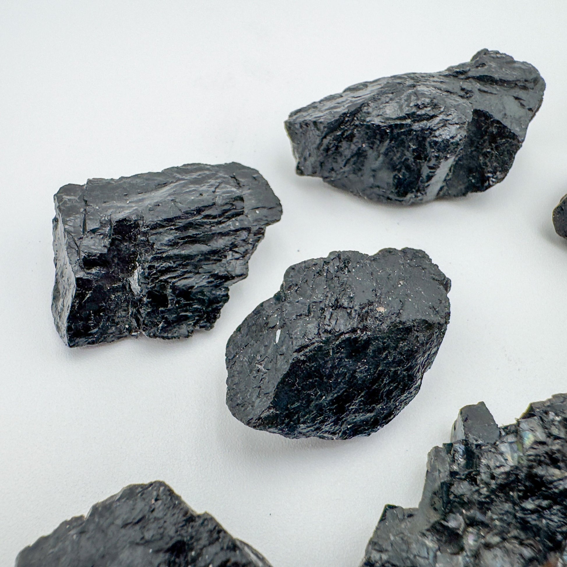 Alternate angle of Grade A Black Tourmaline raw showing overall shape