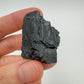 Back view of Grade A Black Tourmaline raw showing natural surface