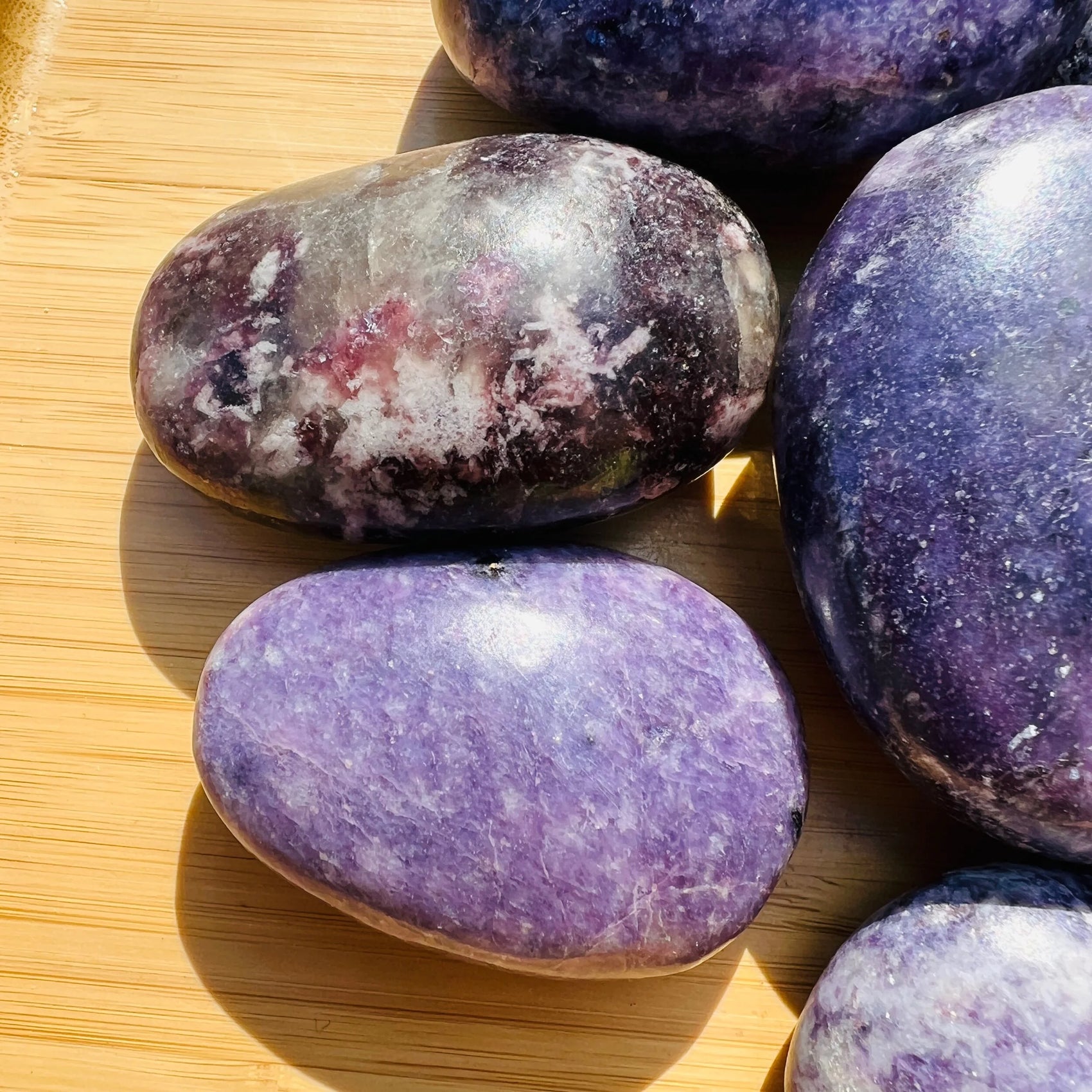 Close-up of Lepidolite palm stone from Madagascar, soothing wellness stone for Emotional Healing