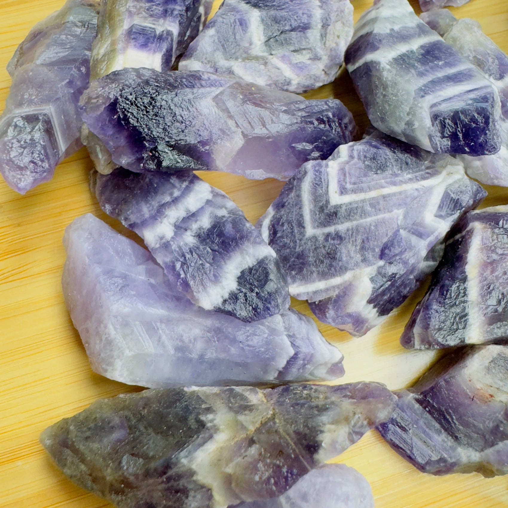 Reverse angle of Chevron Amethyst raw stone, showing natural color depth, Zambia-sourced.