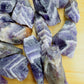 Overhead angle of Grade AA purple Chevron Amethyst raw stone, Zambia-sourced, to support Intuition.