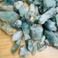 Reverse side of Chlorite Quartz raw point, Zimbabwe-sourced, showing raw matrix.