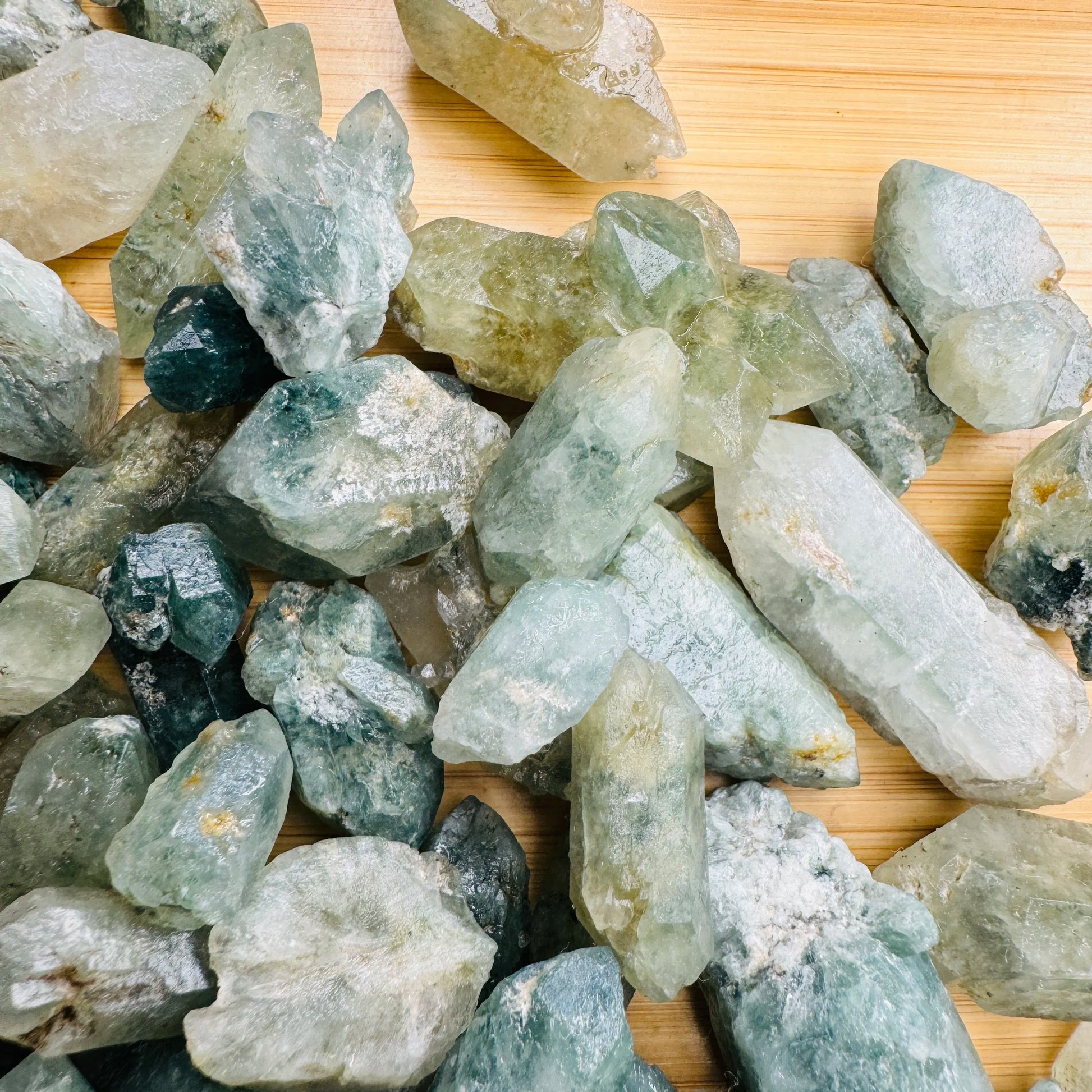 Top-down shot of Chlorite Quartz raw point, drawn on for Healing and Cleansing, showing tight grain.