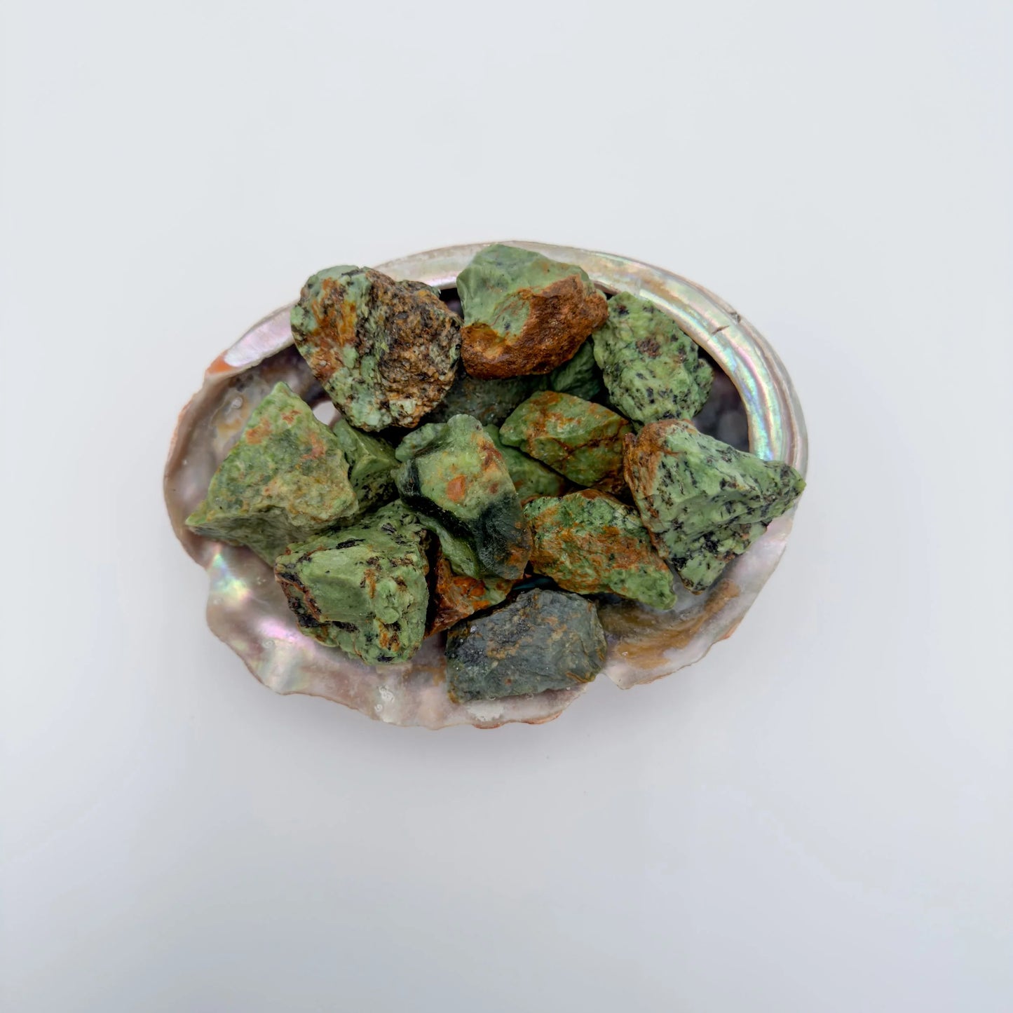 Texture-level view of Chrysoprase raw stone, showing earthy tone.