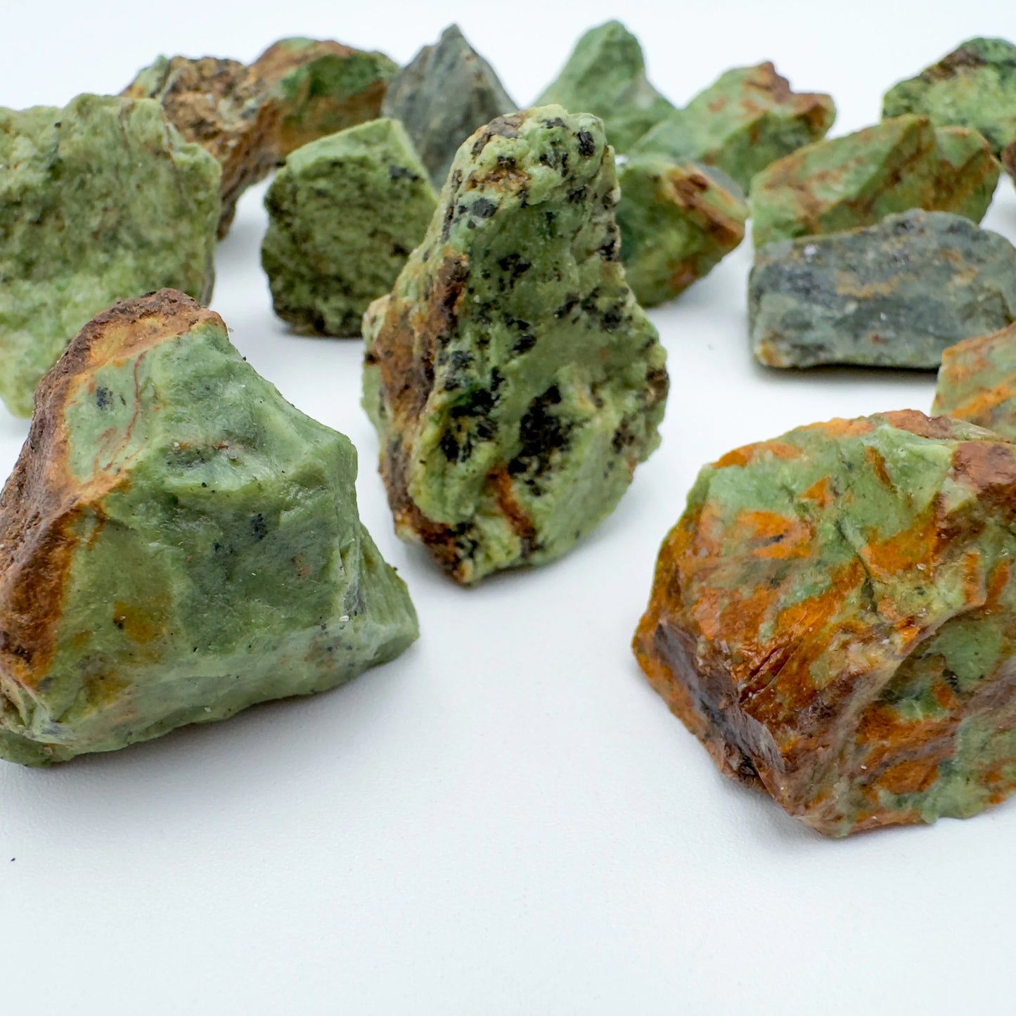 Profile shot of Grade A Chrysoprase raw stone, sourced from Alaotra-Mangoro, Madagascar, kept close for Love and Emotional Healing.