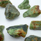 Underside view of Grade A Chrysoprase raw stone, showing open form, from Madagascar.