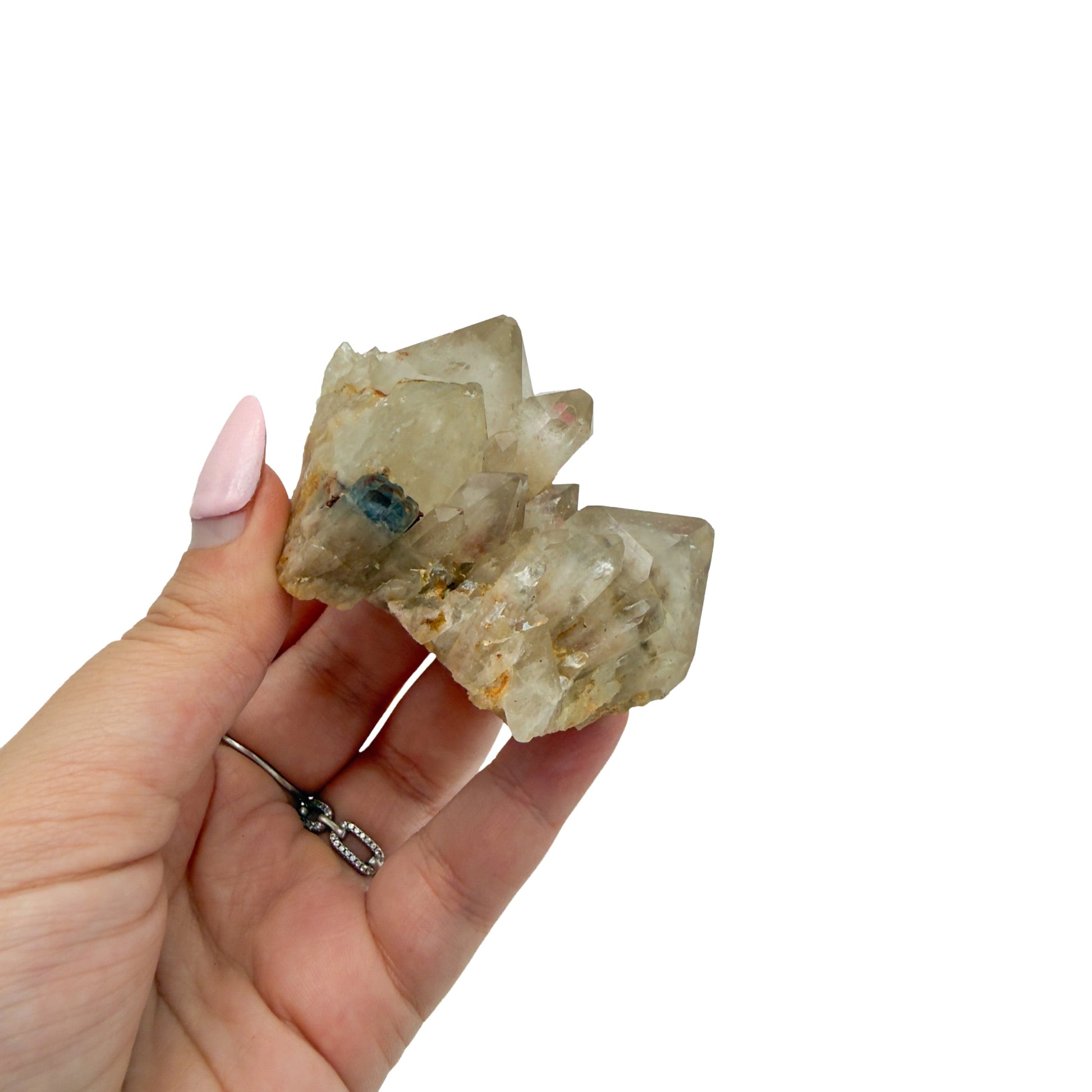 Citrine cluster no. 4 cupped in a hand, giving a sense of its 1.78 inch height and 0.27 pound weight.