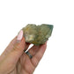 Scale reference for natural citrine no. 13: the 2.45 by 2.09 inch cluster resting in an open hand.