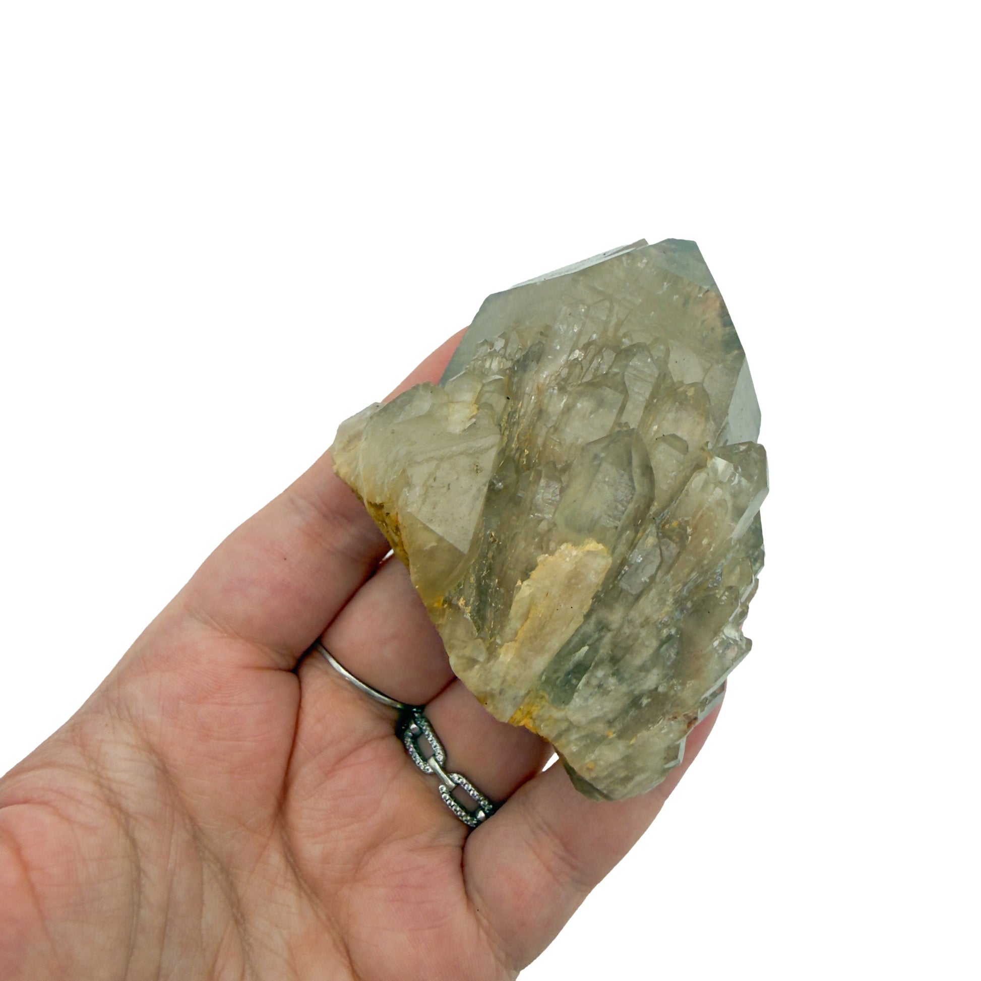A hand holds citrine cluster no. 17 for scale, the 0.42 lb specimen sitting across the palm at 2.23 inches.
