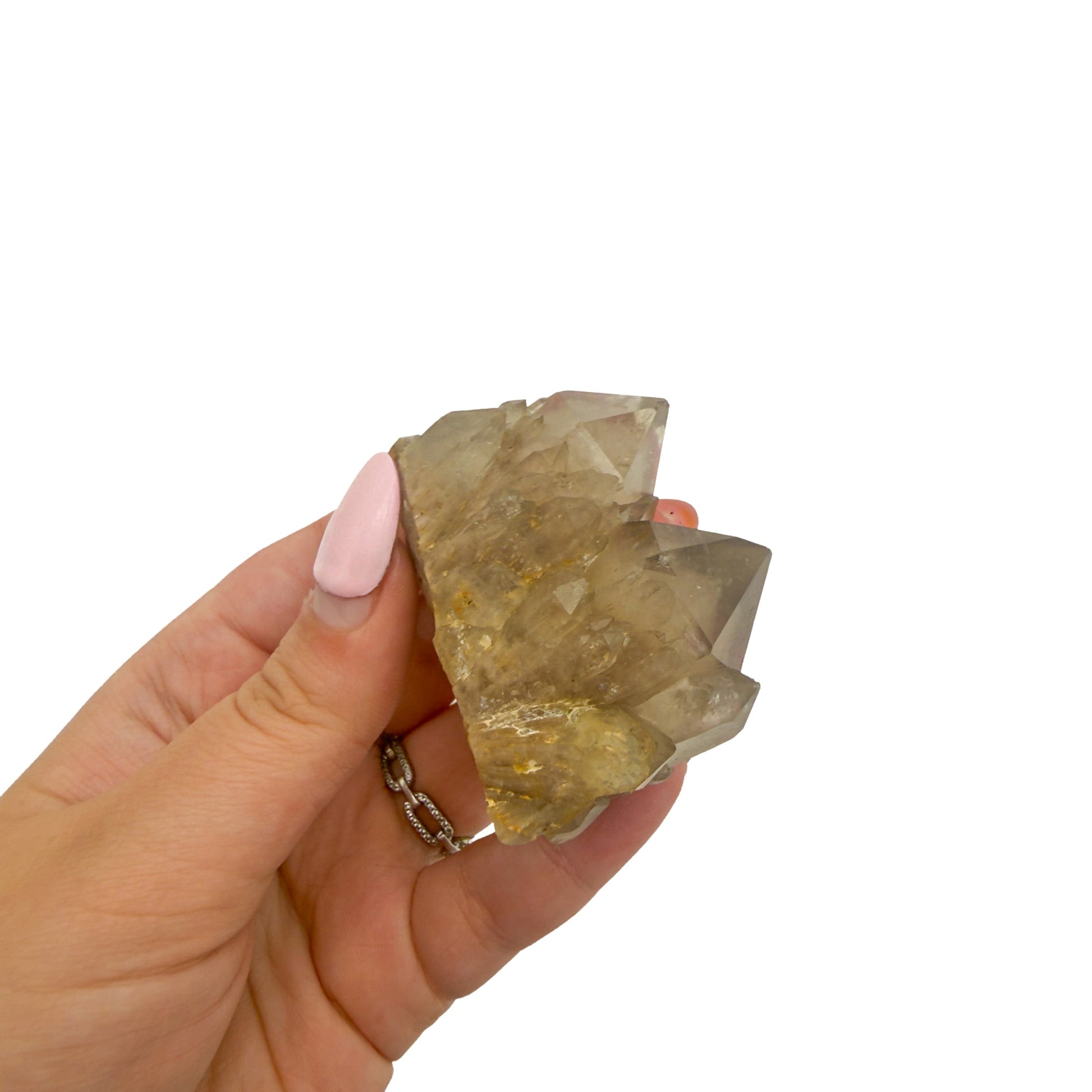 Scale reference for natural citrine no. 28: the 2.16 by 1.10 inch cluster resting in an open hand.