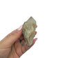 Citrine cluster no. 29 cupped in a hand, giving a sense of its 1.31 inch height and 0.22 pound weight.