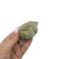 Scale reference for natural citrine no. 33: the 2.52 by 1.59 inch cluster resting in an open hand.