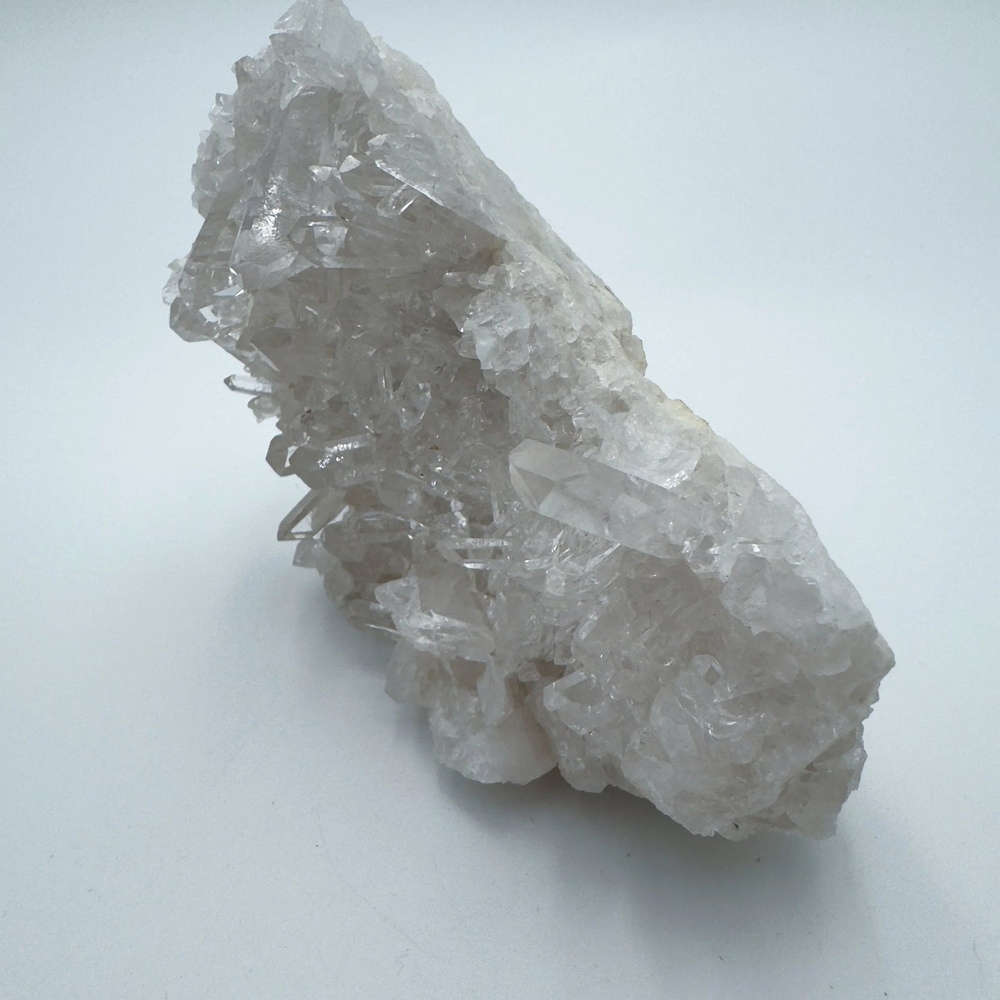 Underside view of Grade AAA Clear Quartz specimen, showing subtle veining.
