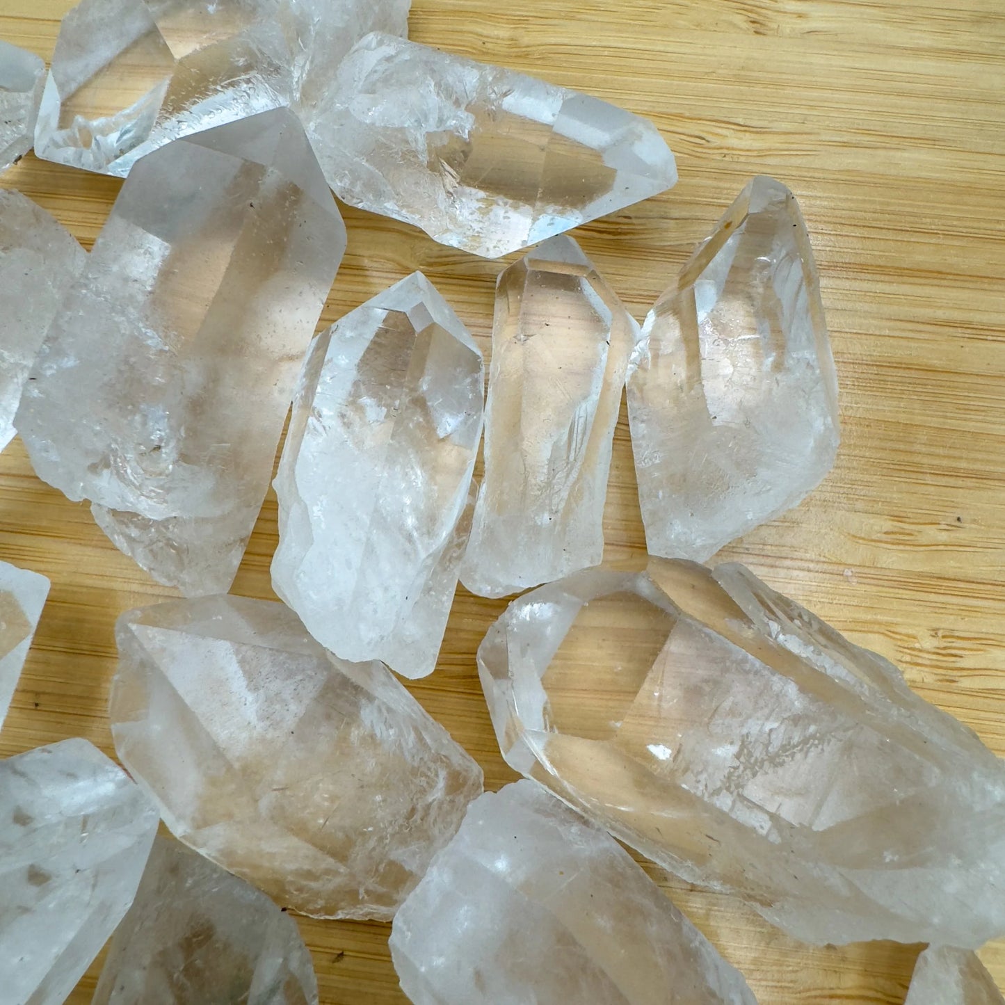 Bird's-eye view of Grade AA Clear Quartz raw point, showing natural texture.