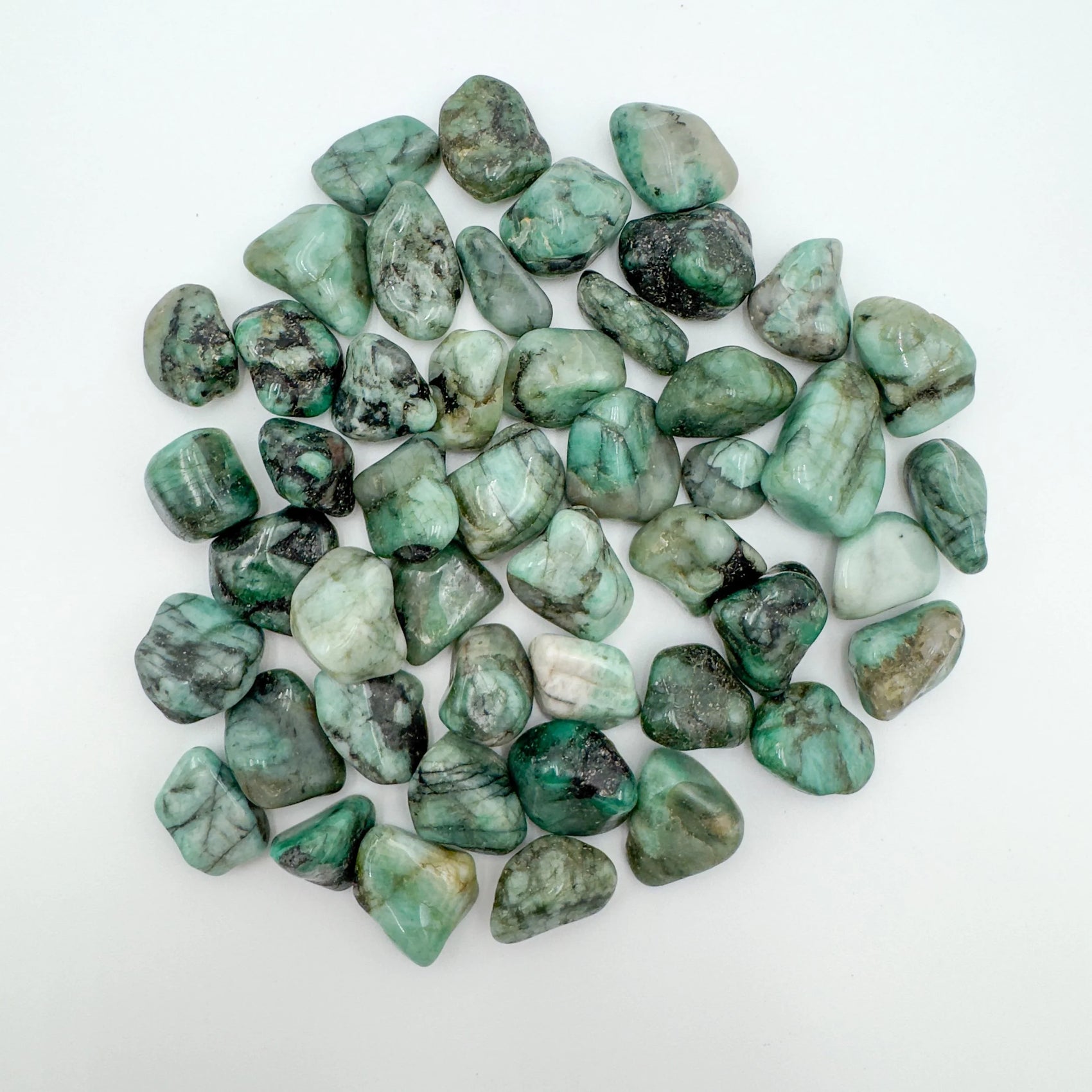Emerald tumbled stone in Green tones, ethically sourced from Brazil for Healing and Emotional Healing