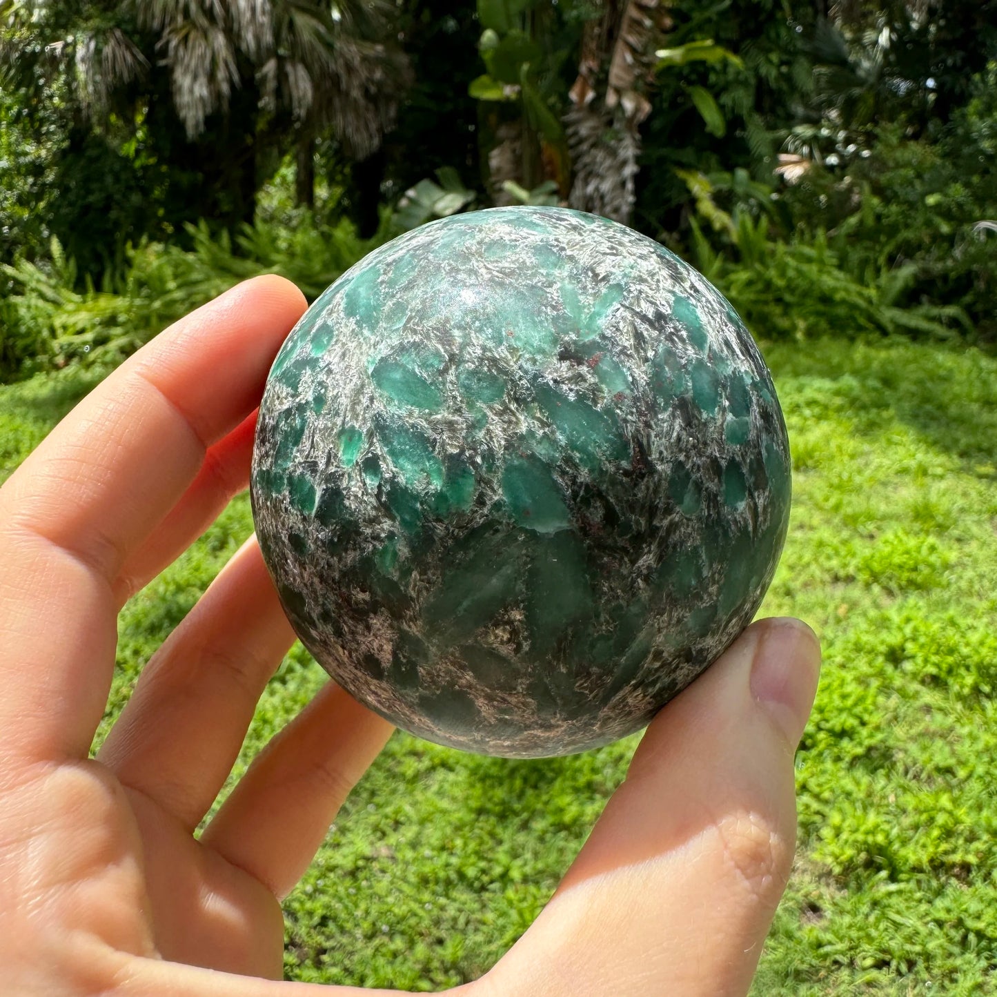 Top view of Emerald polished sphere, Zimbabwe-sourced.