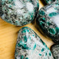 Reverse angle of Emerald palm stone, to support Love and Abundance.