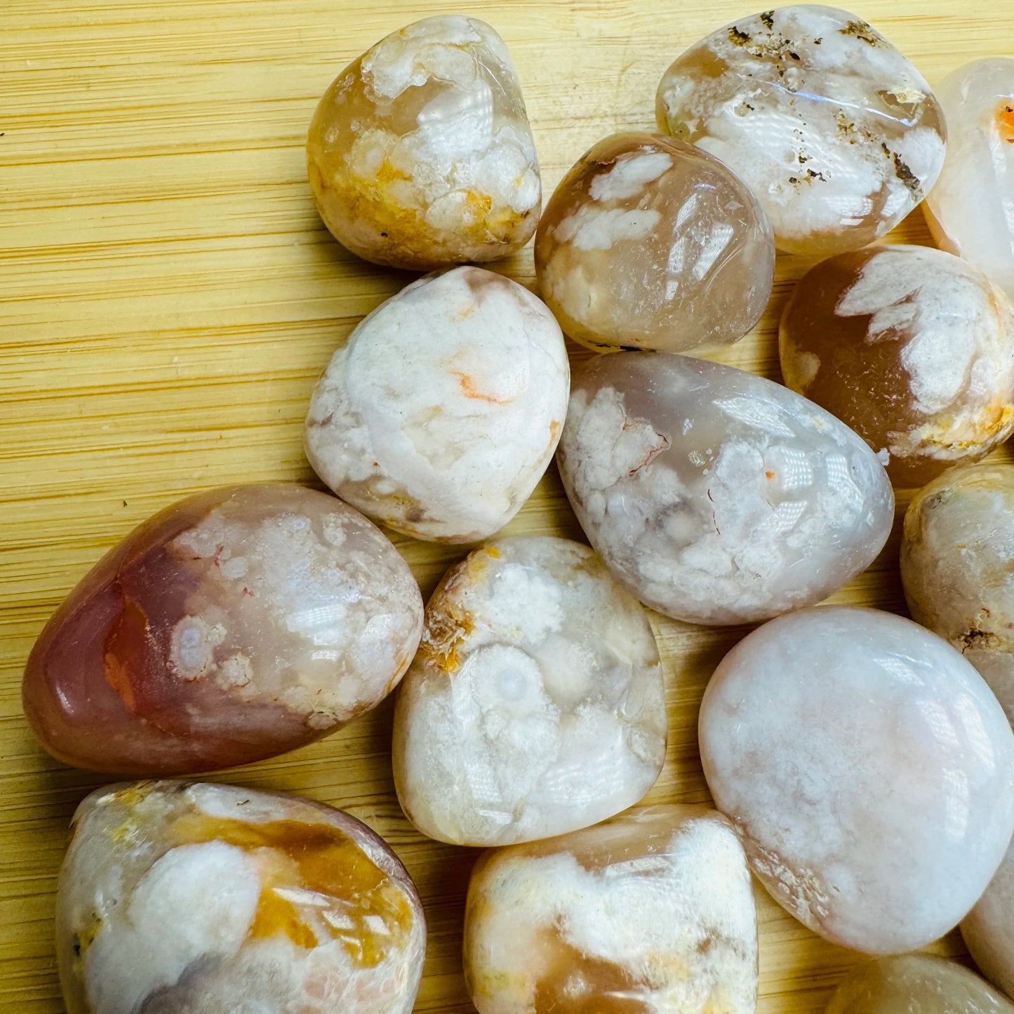 Top-down shot of Flower Agate tumbled stone, carried for Love.