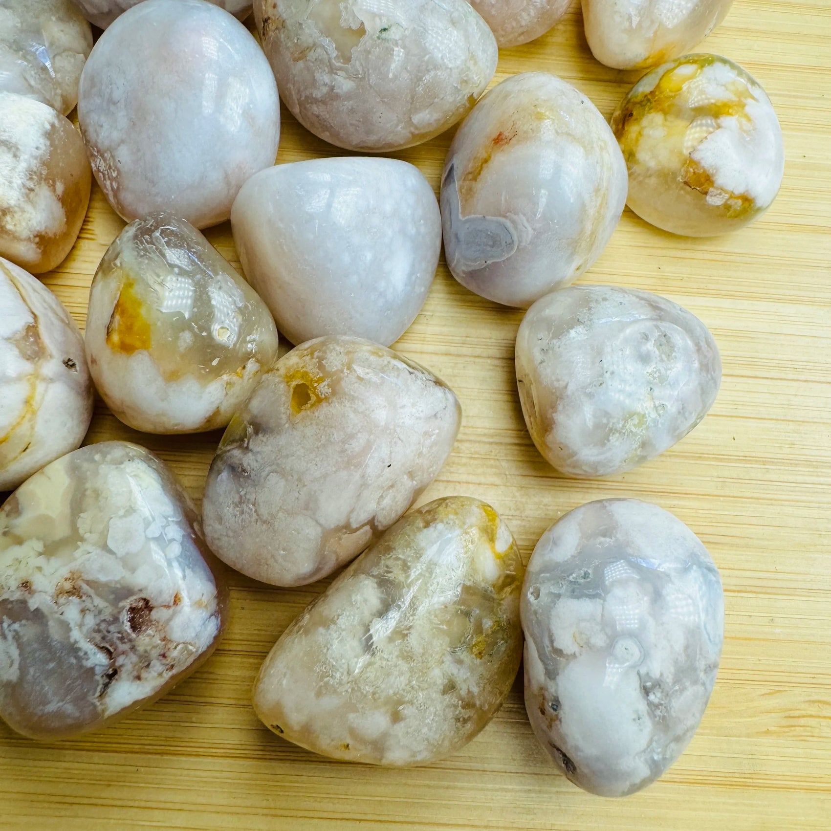 Up-close view of Flower Agate tumbled stone, showing characteristic patterning.