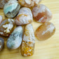 Close detail of Flower Agate tumbled stone, kept near for Love and Emotional Healing, from Madagascar.
