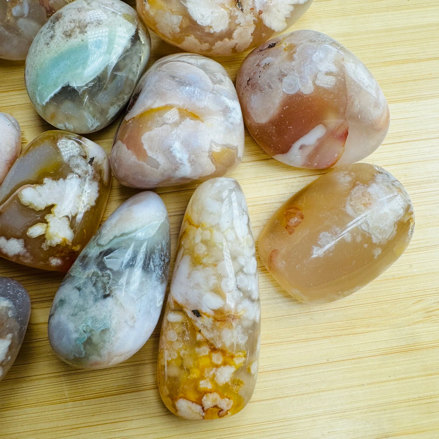 Close detail of Flower Agate tumbled stone, kept near for Love and Emotional Healing, from Madagascar.