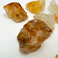 Top-down shot of Grade AA Golden Healer raw stone, Brazil-sourced, showing characteristic finish.