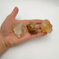Whole-piece view of Golden Healer raw crystal, from Minas Gerais, Brazil, in the warmth of daylight.