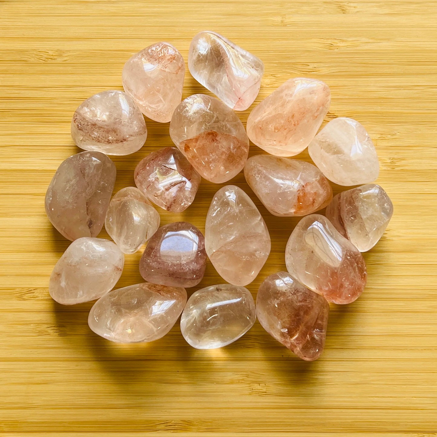 Detail shot of Grade AA Fire Quartz tumbled stone under natural light