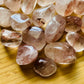 Back view of Grade AA Fire Quartz tumbled stone showing natural surface