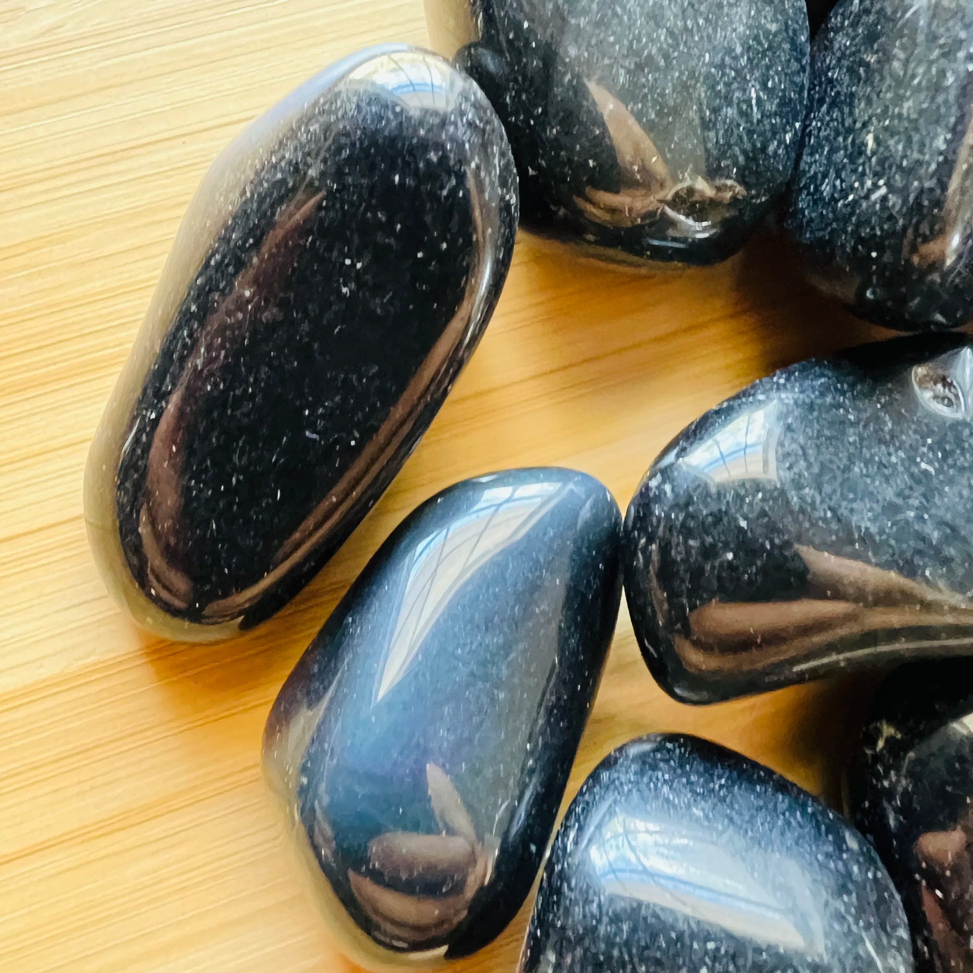 Full profile of Grade AA Rainbow Obsidian tumbled stone ready to ship from Beyond Bohemian