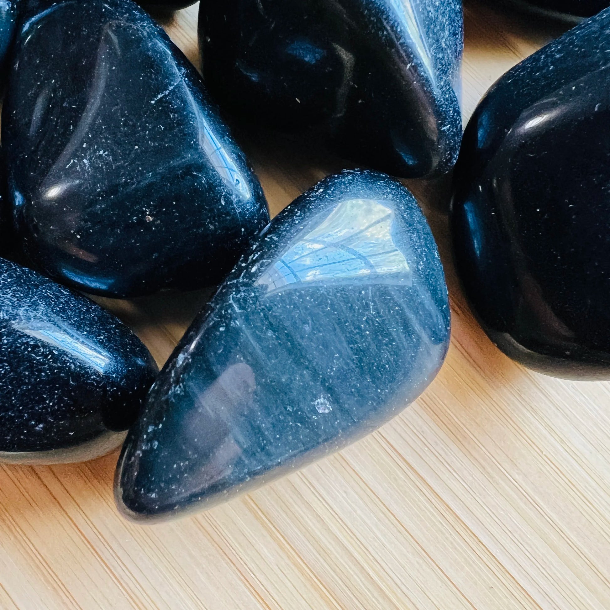 Full profile of Grade AA Rainbow Obsidian tumbled stone ready to ship from Beyond Bohemian
