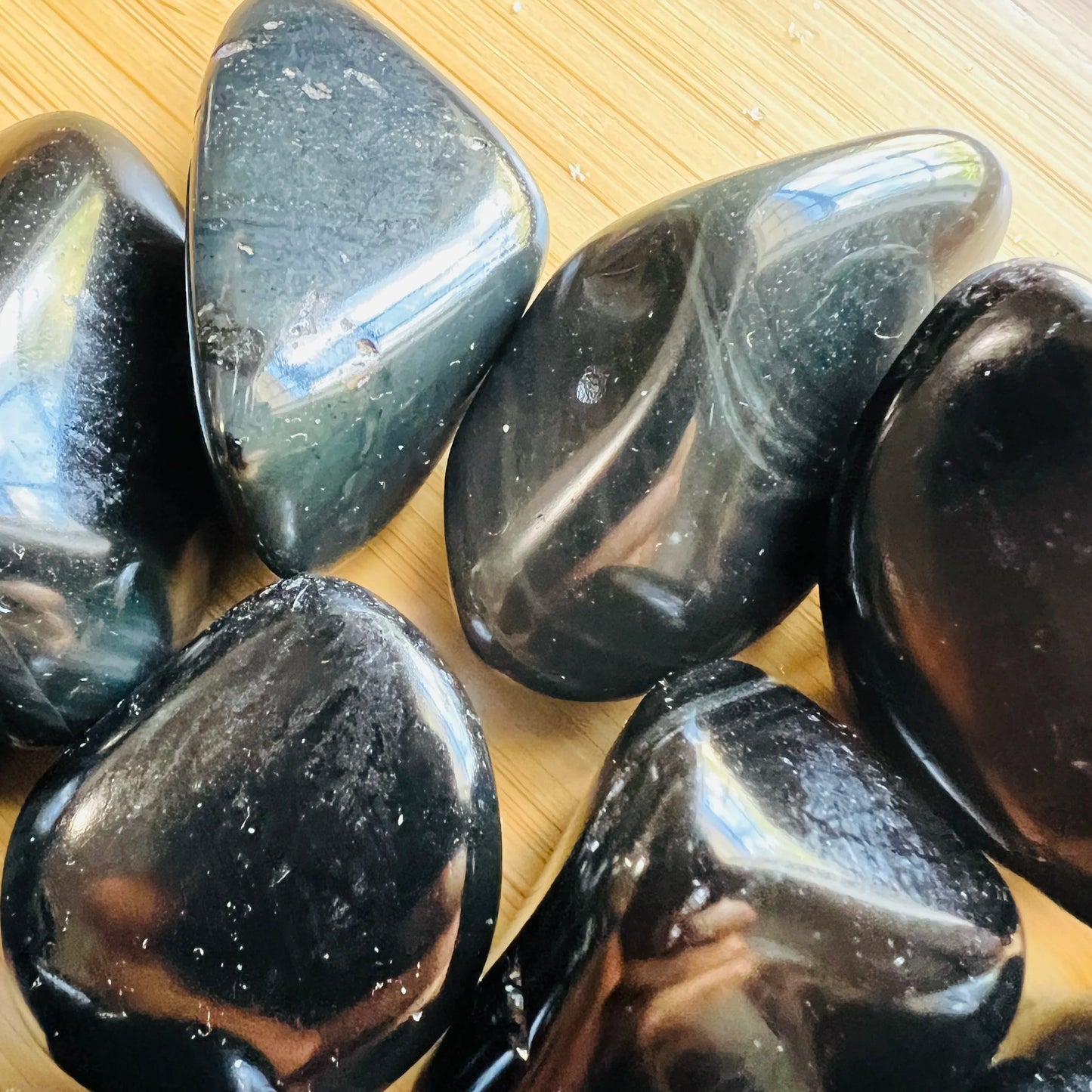 Full profile of Grade AA Rainbow Obsidian tumbled stone ready to ship from Beyond Bohemian