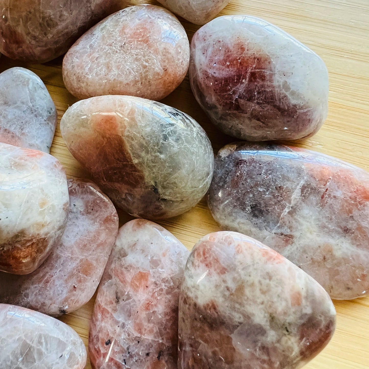 Daylight view of a single Sunstone tumbled stone from Tanzania.