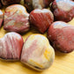 Top view of Petrified Wood polished heart, for Grounding and Protection, from Boeny, Madagascar.