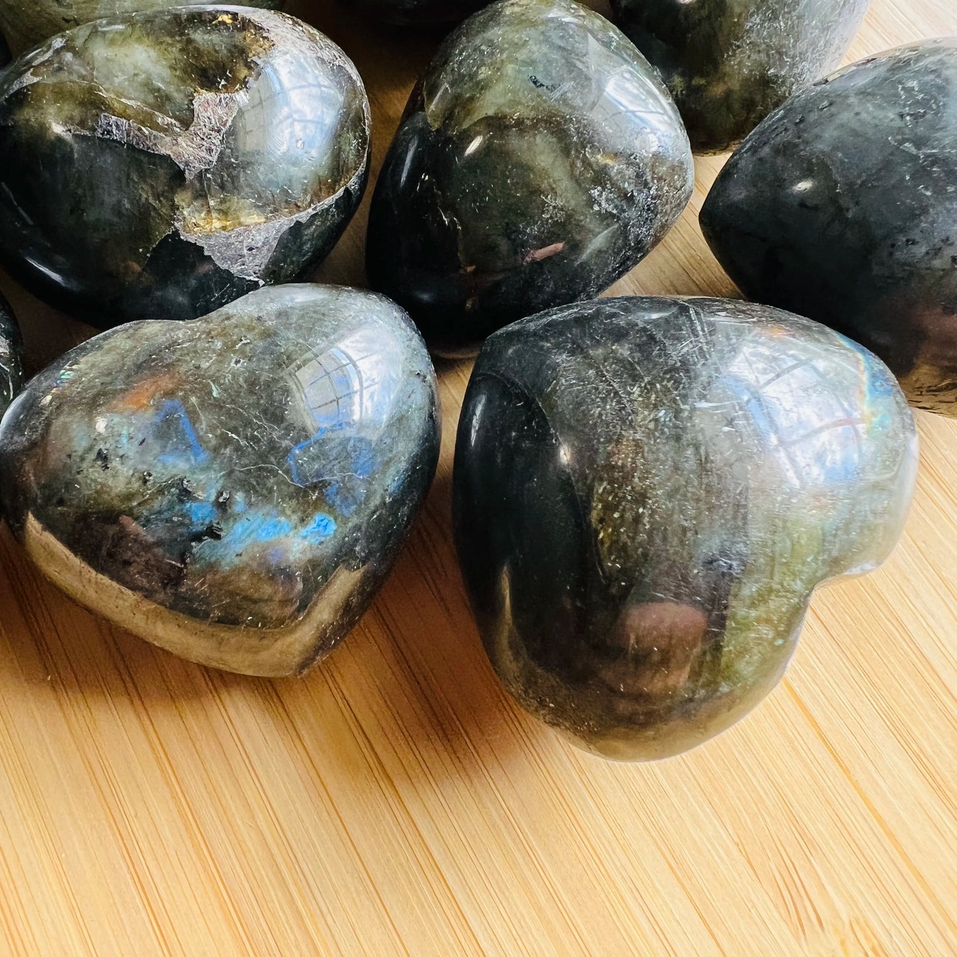 Side angle of Labradorite polished heart, hand-selected from Atsimo-Andrefana, Madagascar.