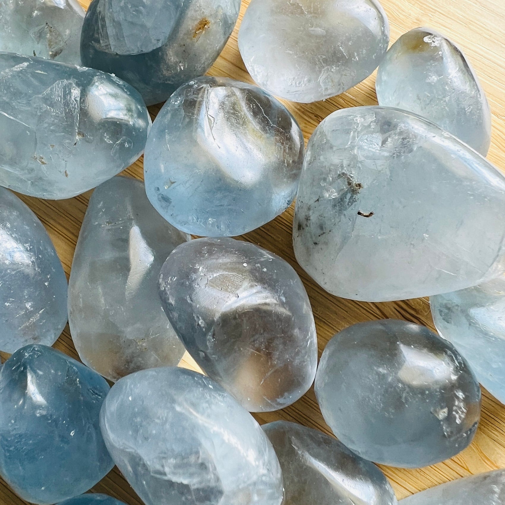 Natural light view of a single Celestite tumbled stone from Madagascar.