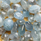 Aerial view of Grade AA Celestite tumbled stone, for Stress Relief, showing characteristic color.
