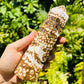 Scale comparison of Ocean Jasper stone, from Sofia, Madagascar, shown in its everyday setting.