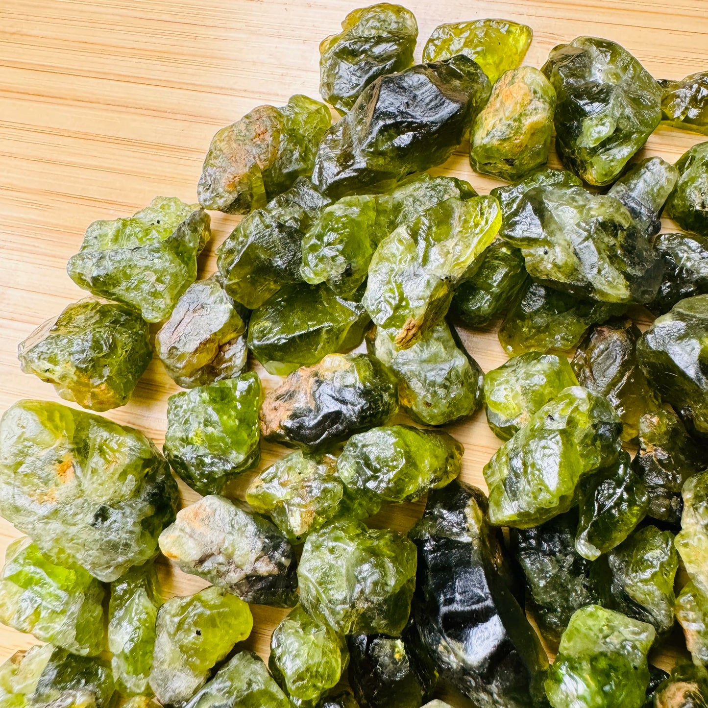 Side angle of Peridot raw stone, hand-selected from San Carlos Apache Reservation, Arizona, United States.