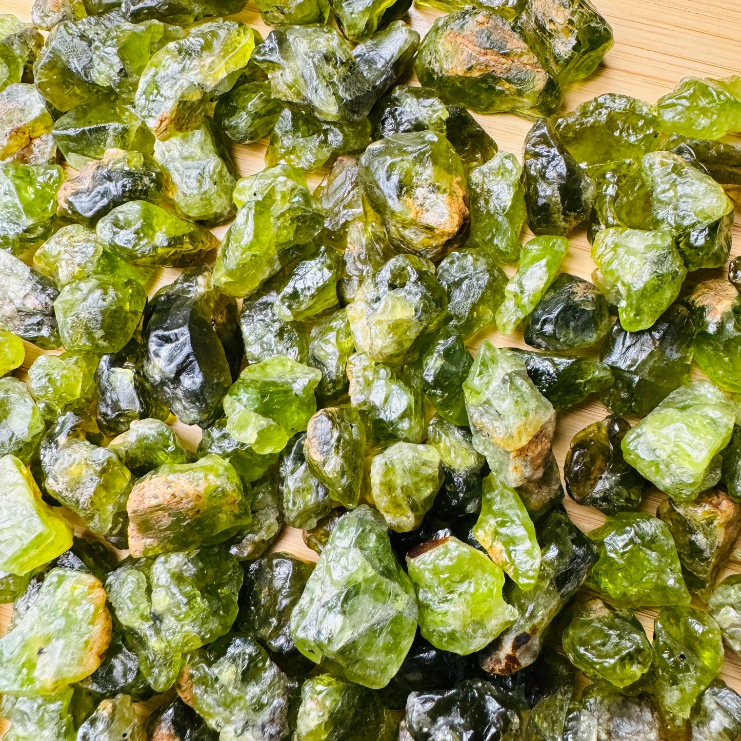 Daylight view of a Peridot raw stone carried for Abundance.