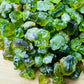 Lateral view of Peridot raw stone, showing natural color depth.