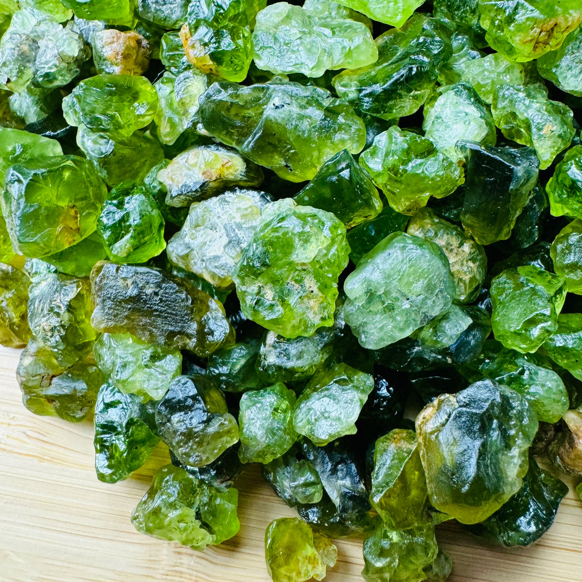 Lateral view of Peridot raw stone, showing natural color depth.