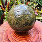 Detail shot of Grade AA Ocean Jasper sphere under natural light