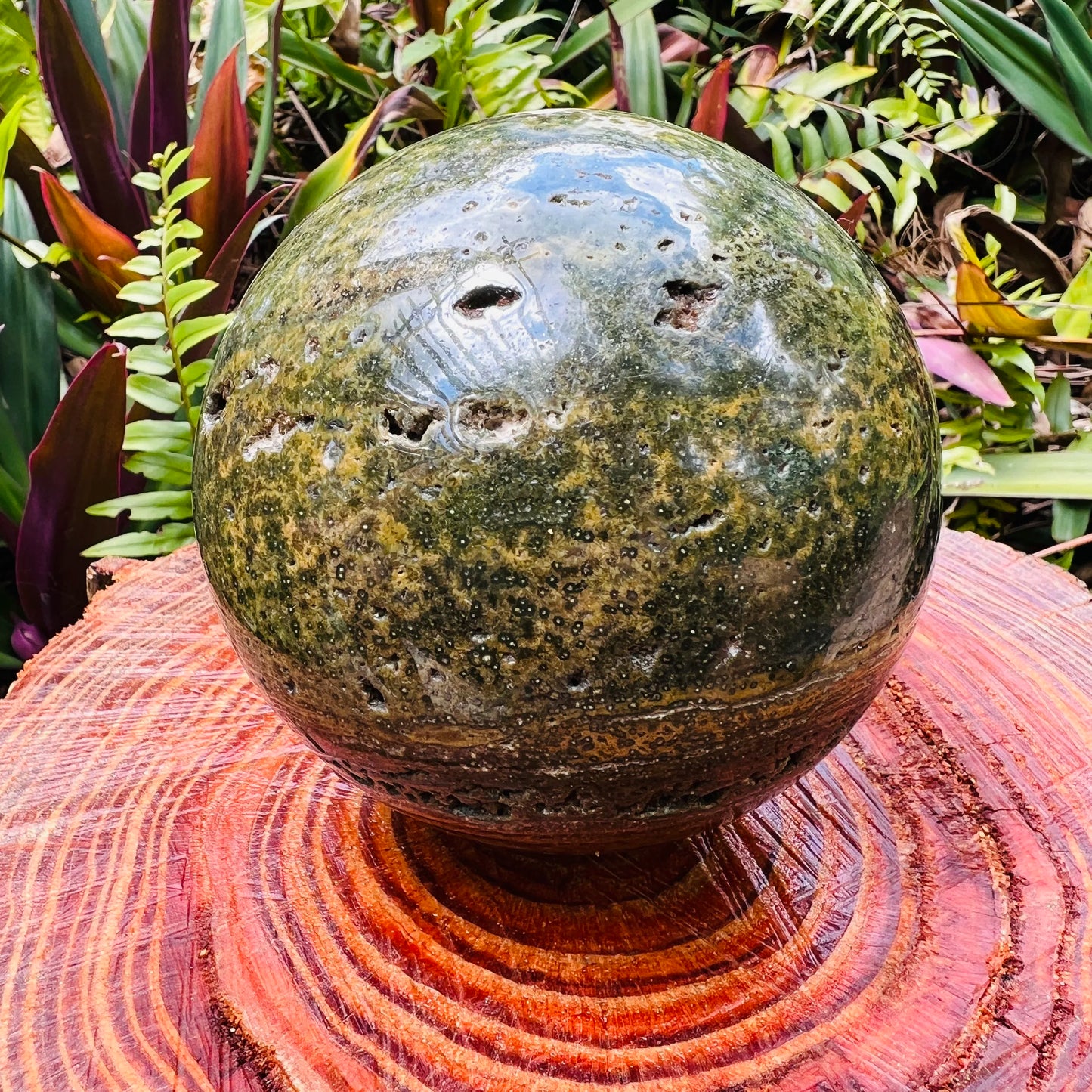 Detail shot of Grade AA Ocean Jasper sphere under natural light