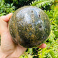 Color detail of green Ocean Jasper polished sphere, showing subtle veining, sourced from Sofia, Madagascar.